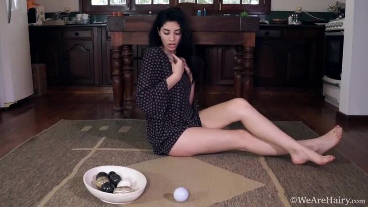 Solo hairy girl Ornella teases with rocks